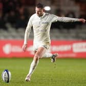 Finn Russell played for Racing 92 in their defeat by Harlequins on Sunday despite intense speculation about his future.