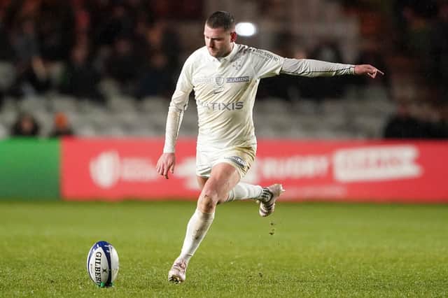 Finn Russell played for Racing 92 in their defeat by Harlequins on Sunday despite intense speculation about his future.