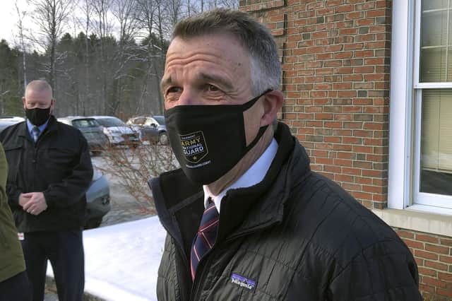 Vermont Republican Gov. Phil Scott speaks to reporters after voting on Tuesday, Nov. 3, 2020, in his hometown of Berlin, Vt. Scott said he voted for Democrat Joe Biden for president because he believes the former vice president can do more to bring the country together. He said it was the first time in his life he's voted for a Democrat. (AP Photo/Wilson Ring)