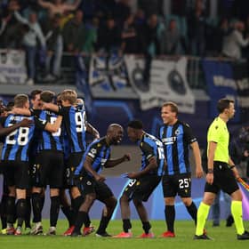 Players of Club Brugge celebrate after victory in the UEFA Champions League Group A match against RB Leipzig.