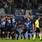 Players of Club Brugge celebrate after victory in the UEFA Champions League Group A match against RB Leipzig.