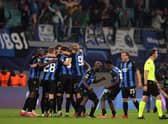Players of Club Brugge celebrate after victory in the UEFA Champions League Group A match against RB Leipzig.