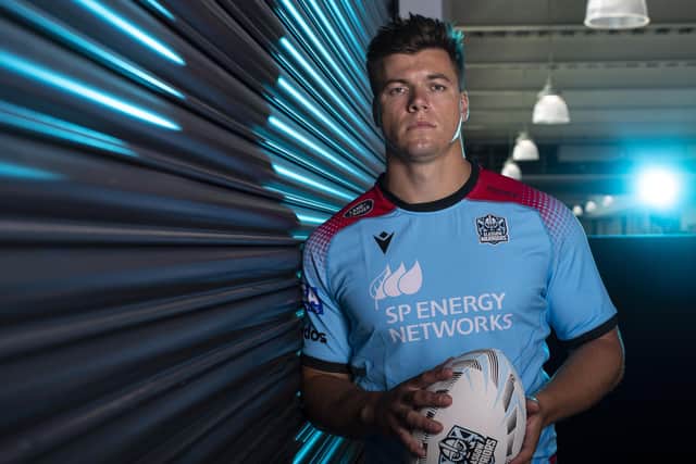 Huw Jones aggravated a back injury while playing for Harlequins. (Photo by Ross MacDonald / SNS Group)