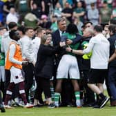 Hibs' Rocky Bushiri clashes with Hearts players at full time of last weekend's derby.