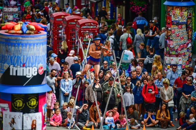 Edinburgh Festival Fringe entertainers perform on the Royal Mile in August 2019 (Picture: Jeff J Mitchell/Getty Images)