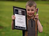Four-year-old Hanlon Stevenson receives a Chief Constable's Bravery and Excellence Award from Sir Iain Livingstone during a ceremony at the Police Scotland headquarters in Tulliallan, Kincardine, Fife. Picture: Andrew Milligan/PA Wire