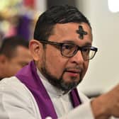 A priest will officiate Ash Wednesday by rubbing ashes in a cross-shape onto the head of church-goers, signifying the beginning of Lent (Picture: Getty Images)