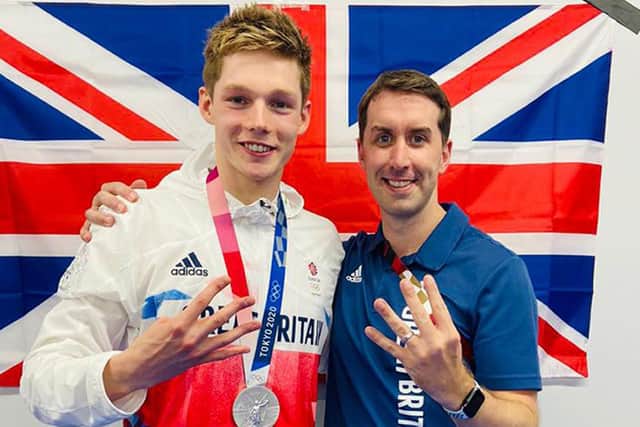 Duncan Scott with his University of Stirling coach Steven Tigg. Picture: University of Stirling /PA Wire