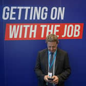 A man checks his phone on the first day of the Conservative Party Conference at Manchester Central Convention Complex. Picture: Ian Forsyth/Getty Images