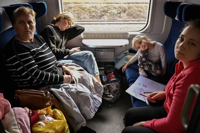 Refugees fleeing war-torn Ukraine take a train from Przemysl to Szczecin in Poland. Picture: Getty Images