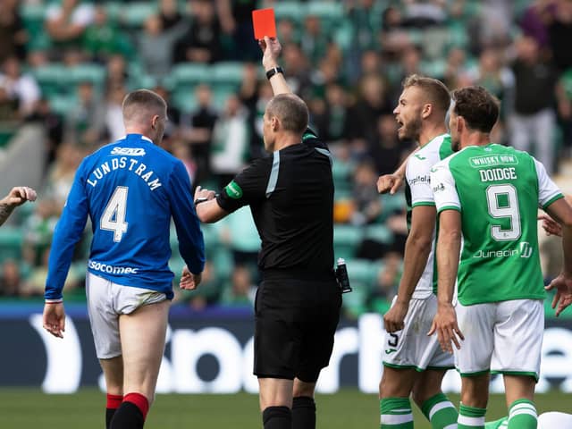 Referee Willie Collum shows a red card to John Lundstram during Hibs' 2-2 draw with Rangers.
