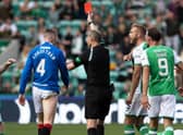 Referee Willie Collum shows a red card to John Lundstram during Hibs' 2-2 draw with Rangers.