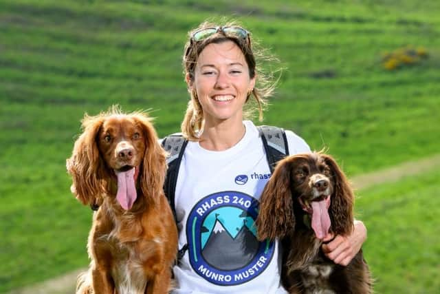 Munro-bagging Hollie Jenkins and her two spaniels Hugo and Spencer support the launch of Munro Muster. Picture: RHASS