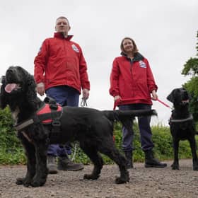 Fife-based John Miskelly with his dog Bramble alongside team member Emma Dryburgh and her dog Dougal
John leads a specialist dog team which finds dead bodies and is on standby to help in Ukraine