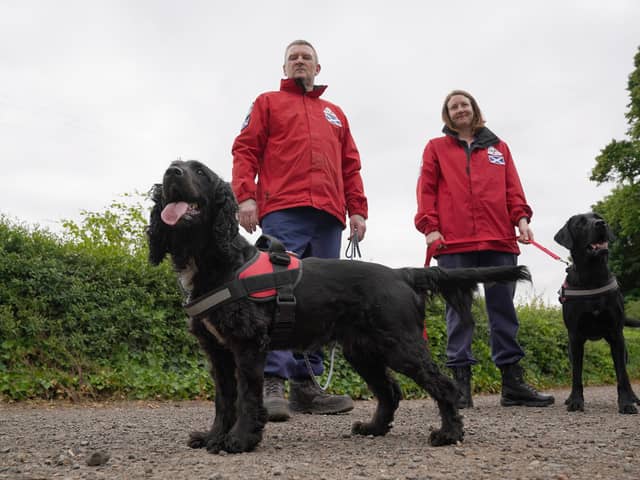 Fife-based John Miskelly with his dog Bramble alongside team member Emma Dryburgh and her dog Dougal
John leads a specialist dog team which finds dead bodies and is on standby to help in Ukraine