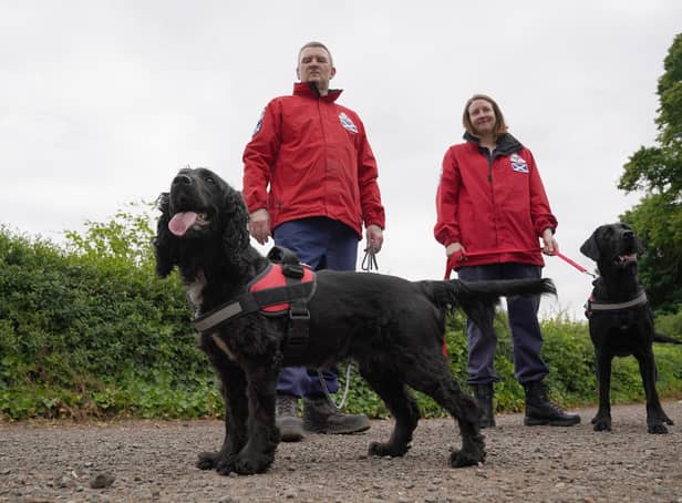 Fife-based John Miskelly with his dog Bramble alongside team member Emma Dryburgh and her dog Dougal
John leads a specialist dog team which finds dead bodies and is on standby to help in Ukraine