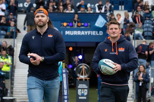 James Johnstone, right, with Ben Toolis, delivers the match ball ahead of Edinburgh's match with Glasgow Warriors. (Photo by Ross Parker / SNS Group)