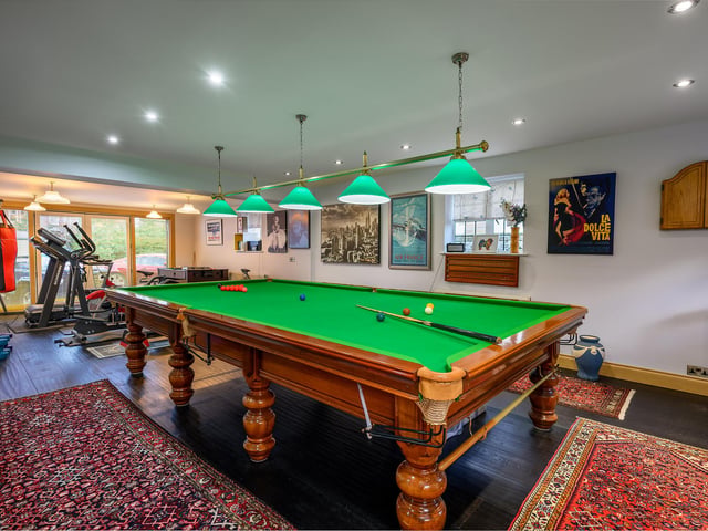 Not all parts of the house are classically 1920s. The couple are keen snooker players, so two rooms at the side of the house – an office and playroom – and the garage were joined together to create a modern games room, with a full-sized baize.