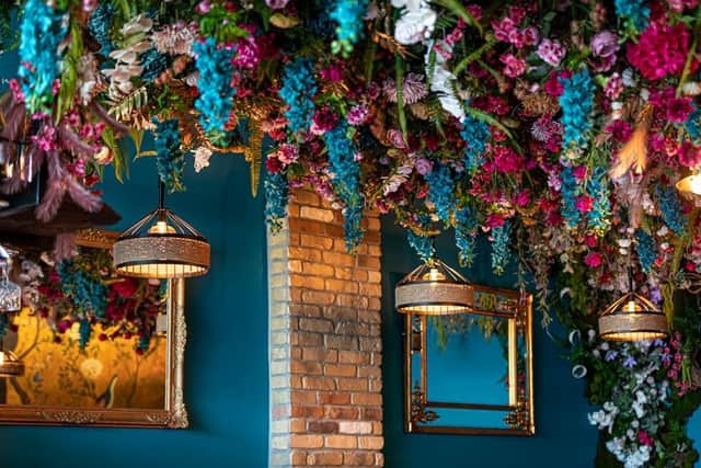 The restaurant’s multicoloured decor includes ornate gold wallpaper decorated with peacocks and a ceiling covered in flowers. Picture: contributed.