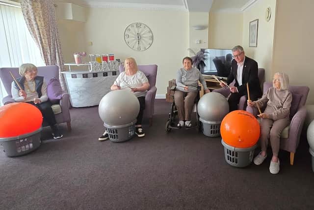 Stuart McMillan, Member of Scottish Parliament (MSP) for Greenock and Inverclyde with residents at HC-One Scotland’s Merino Court Care Home celebrating Care Home Open Week 2025