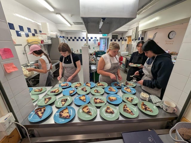 Participants serving the tart.