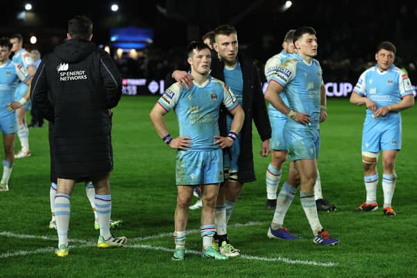 George Horne of Glasgow Warriors is consoled after their defeat by Harlequins.