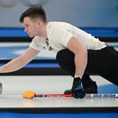 Britain's Bruce Mouat in action at the Beijing 2022 Winter Olympic Games curling competition (Photo by LILLIAN SUWANRUMPHA/AFP via Getty Images)