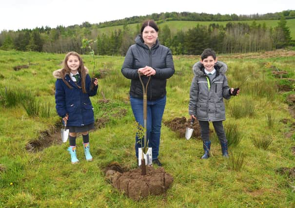 Councillor Susan Aitken, leader of Glasgow City Council, gets digging with local children as plans are unveiled to plant 18 million trees, ten for every adult and child in the area, as part of the new Clyde Climate Forest initiative (Picture: Glasgow City Region)