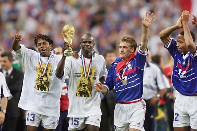 Thuram celebrates winning the World Cup in 1998 with France alongside Bernard Diomede, Didier Deschamps and Thierry Henry.