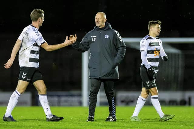 Ayr manager Lee Bullen (centre) and Aaron Muirhead at full time after defeating leaders Arbroath. (Photo by Roddy Scott / SNS Group)