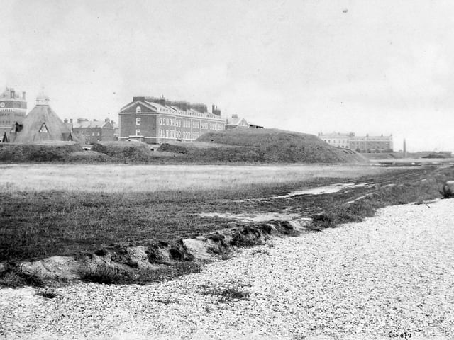 View of Eastney Barracks from the south-west c1890. Eastney Fort West can be seen in the foreground with a gun showing. Eastney Fort East is just visible in the far distance to the right. Note the esplanade road has yet to be built.