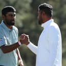 Sahith Theegala is congratulated by playing partner Tony Finau on the 18th green in the final round of the 2023 Masters at Augusta National Golf Club. Picture: Patrick Smith/Getty Images.