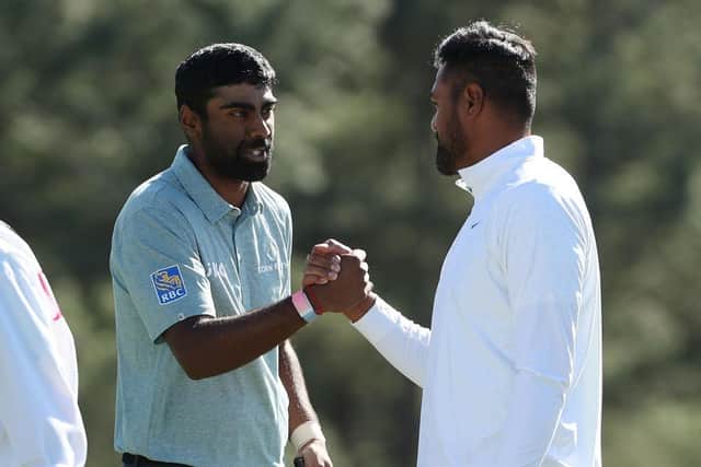Sahith Theegala is congratulated by playing partner Tony Finau on the 18th green in the final round of the 2023 Masters at Augusta National Golf Club. Picture: Patrick Smith/Getty Images.