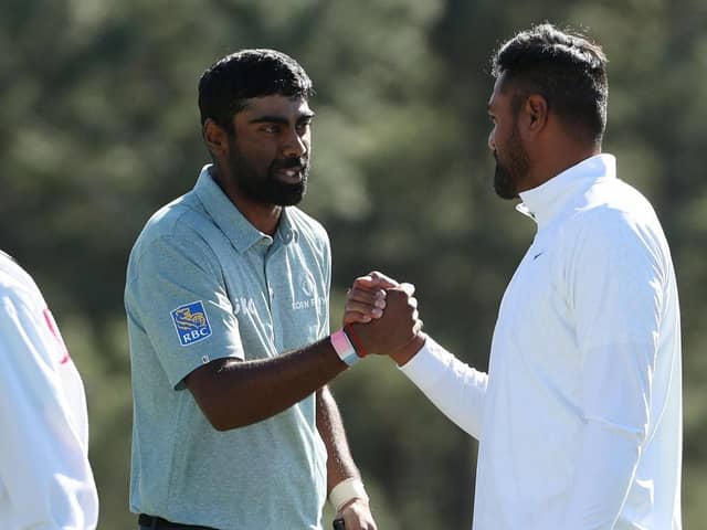 Sahith Theegala is congratulated by playing partner Tony Finau on the 18th green in the final round of the 2023 Masters at Augusta National Golf Club. Picture: Patrick Smith/Getty Images.