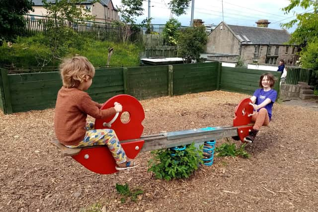 Robin playing with sister Audrey