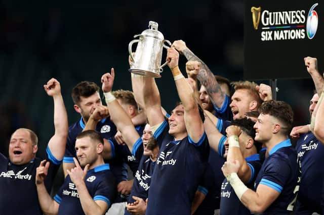 Jamie Ritchie of Scotland lifts the Calcutta Cup after the team's victory against England.