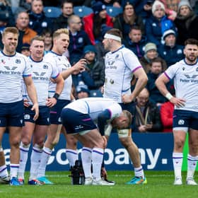 The Scotland team look on with dejection after defeat by France at BT Murrayfield.