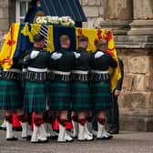 The Princess Royal curtseys before the coffin of Queen Elizabeth II as it arrives at the Palace of Holyroodhouse last Sunday after she followed her mother in the funeral cortege from Balmoral to Edinburgh. PIC: WPA Pool.