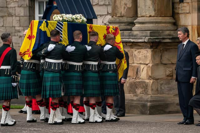The Princess Royal curtseys before the coffin of Queen Elizabeth II as it arrives at the Palace of Holyroodhouse last Sunday after she followed her mother in the funeral cortege from Balmoral to Edinburgh. PIC: WPA Pool.
