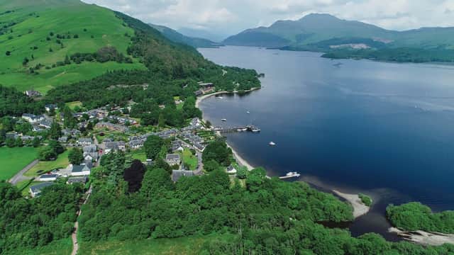 Aerial image over the picturesque village of Luss on the banks of Loch Lomond. Copyright (c) 2018 TreasureGalore/Shutterstock