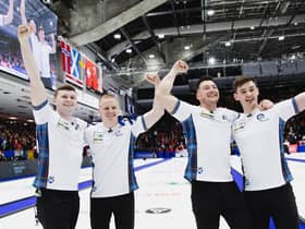 Scotland celebrate their win over Canada at the World Championships.