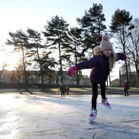 Isla Rose (9) skates on a frozen pond at Victoria Park in Glasgow.