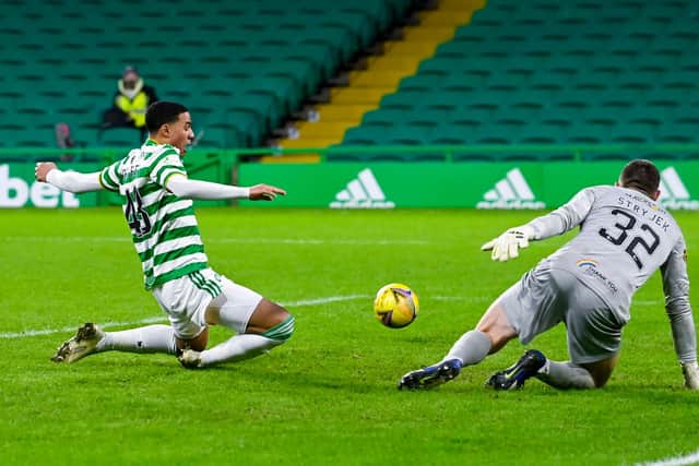 Celtic's Armstring Oko-Flex just can't reach an Anthony Ralston cross in one of the closest calls in a dreary draw against Livnigston for the depleted Parkead side. (Photo by Rob Casey / SNS Group)