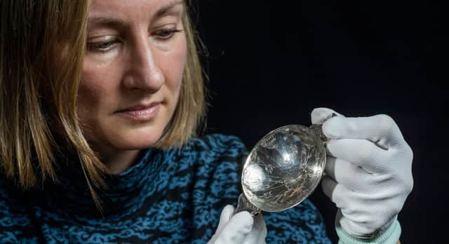 Curator Lyndsay McGill with the 17th Century quaich, one of three exceptionally rare Scottish silver items that have been gifted to the national collection. PIC: Phil Wilkinson.