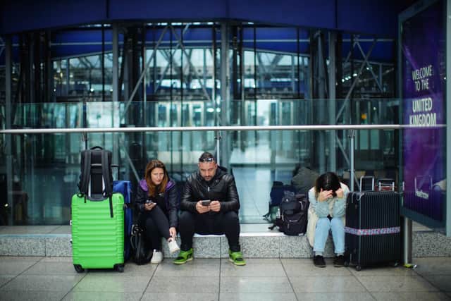 Stranded passengers at Heathrow Terminal 5 in London this morning. Photo: James Manning/PA Wire