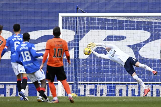 Allan McGregor makes a save from Louis Appere's strike during a Scottish Premiership match between Rangers and Dundee United at Ibrox on February 21, 2021, in Glasgow, Scotland (Photo by Rob Casey / SNS Group)