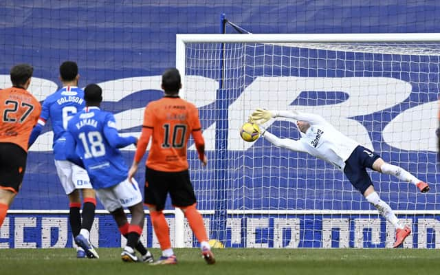 Allan McGregor makes a save from Louis Appere's strike during a Scottish Premiership match between Rangers and Dundee United at Ibrox on February 21, 2021, in Glasgow, Scotland (Photo by Rob Casey / SNS Group)