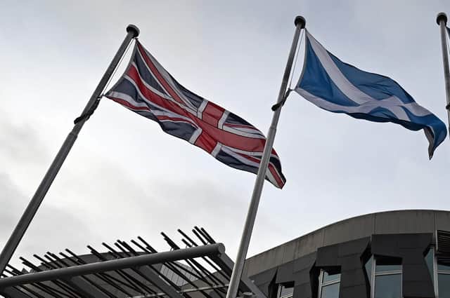Scottish independence and unionism are often represented by the Saltire and the Union Jack, but there is a third choice: Home Rule (Picture: Andy Buchanan/AFP via Getty Images)