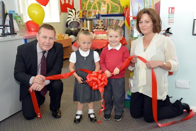 Blackhall Primary school pupils Summer Jardine and Archie Turner give a helping hand t Durham County Councillors Rob Crute and Lynne Pounder to cut the ribbon to mark the refurbishment of the junior section at Blackhall Library 8 years ago.