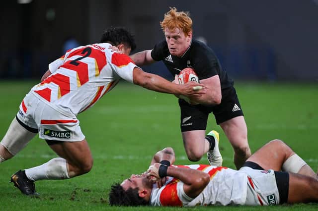 New Zealand's Scottish-born scrum-half Finlay Christie in action against Japan.  (Photo by RICHARD A. BROOKS/AFP via Getty Images)